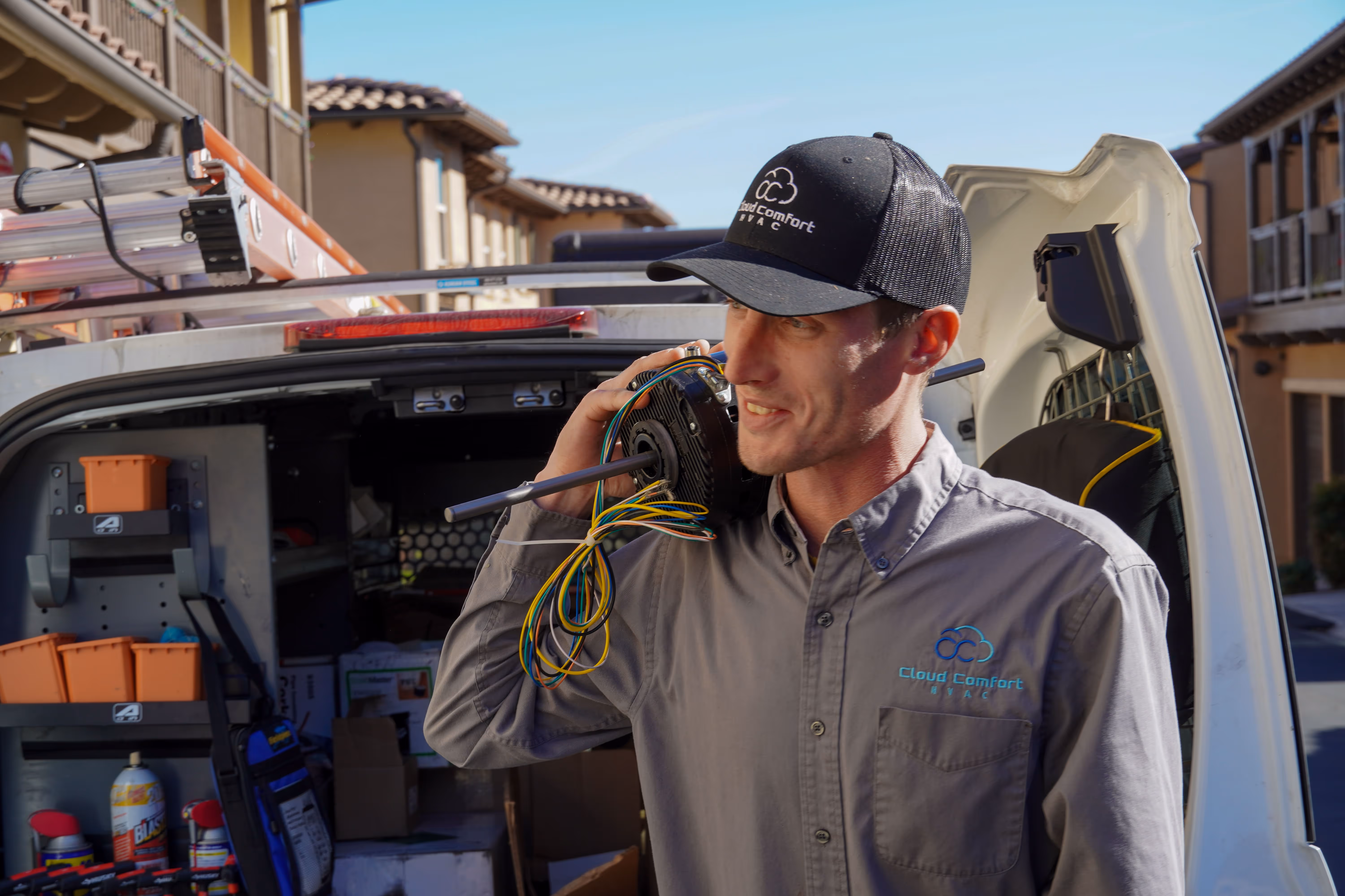 Cloud Comfort HVAC technician servicing an outdoor AC unit on a South Bay home